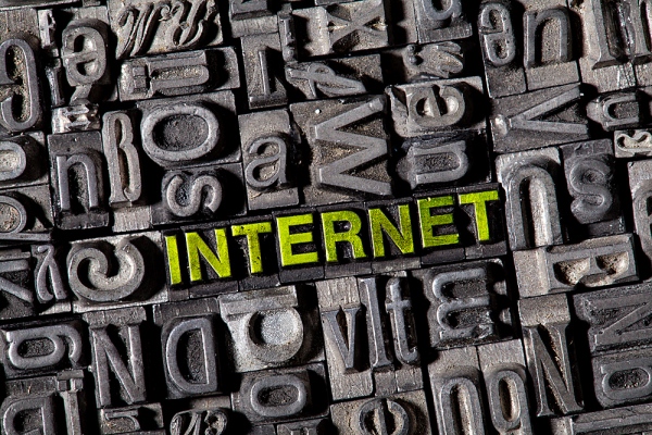 Old lead letters spelling the word  iNTERNET
